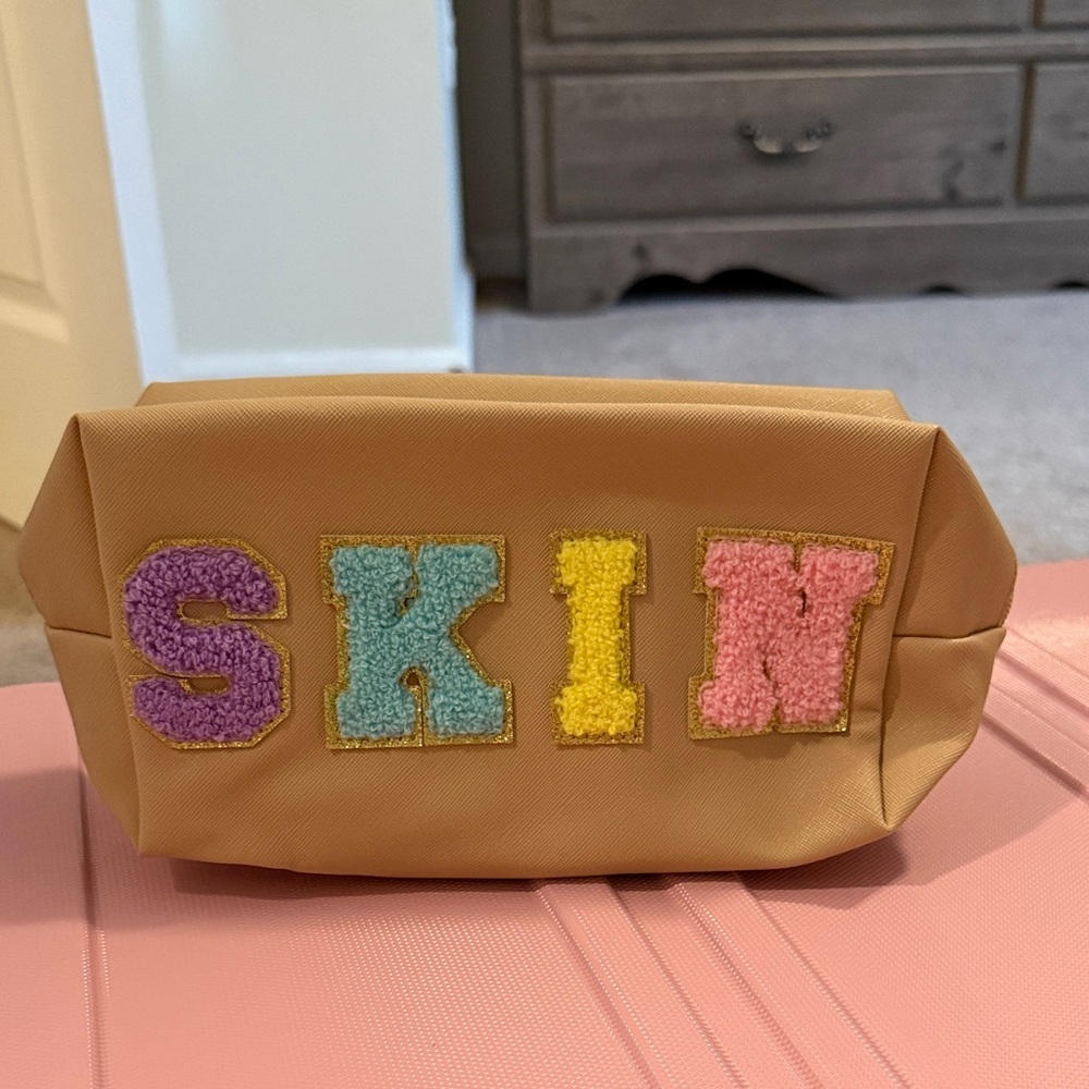 Colorful Lettered Tan Pouch